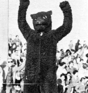 Early UNC Mascot with arms in air